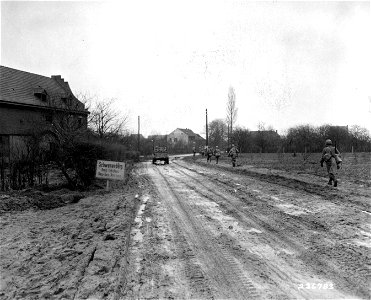SC 336783 The first battalion of the 84th Division enters Schwanenberg, Germany. photo