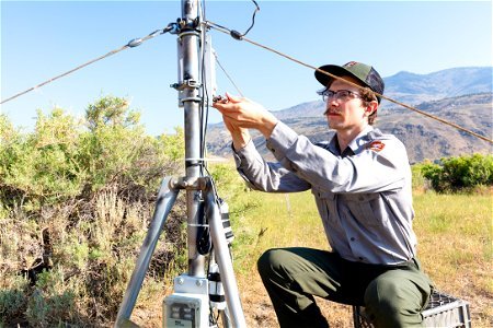 Ben Banet, GIS Technician, downloading data from climate monitoring site (2) photo