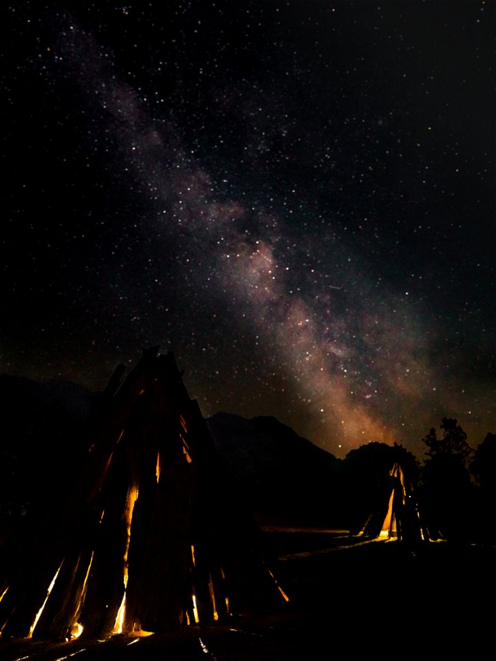 Galactic Core rises over bark houses at the San Joaquin River Gorge