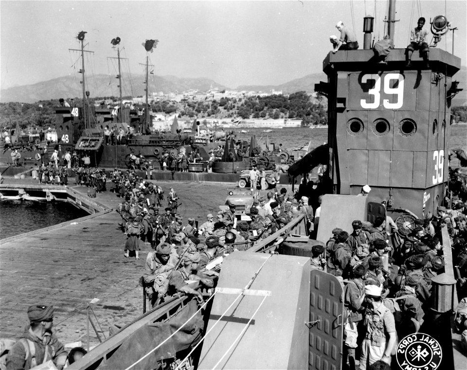 SC 329865 - Troops of the French 9th Colonial Inf. Div., boarding LCI in preparation for the invasion of Elba.
