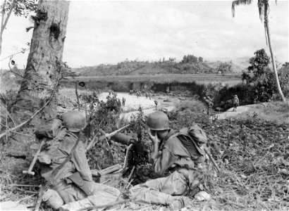 SC 364502 - Heavy machine guns covering the advance of troops over streams near Ormac. 13 December, 1944. photo