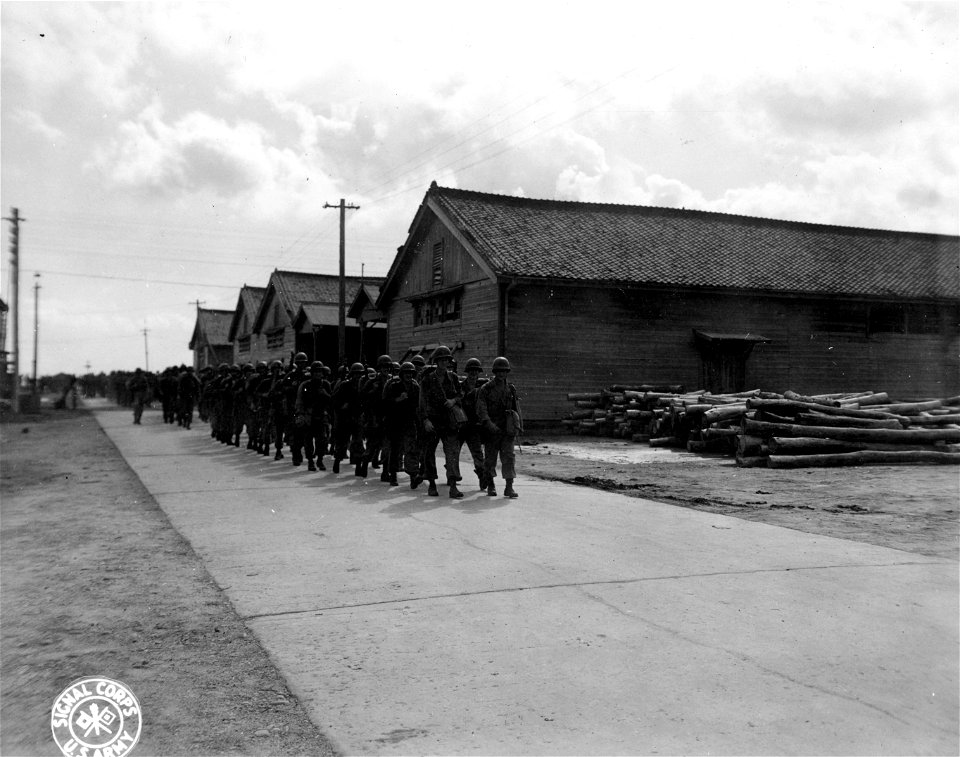 SC 270788 - American troops are shown marching from the docks in Inchon, Korea, after their landing.