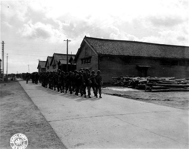 SC 270788 - American troops are shown marching from the docks in Inchon, Korea, after their landing.