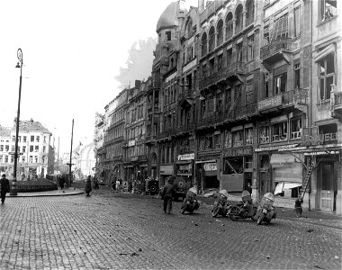 SC 329798 - View of buildings on east side of square following following V-1 hit about 1300 hours on 5 Jan 45 at Retne Astrid, Carnot Straat and Van Schoonhoven Straat, Antwerp, Belgium. 5 January, 1945. photo