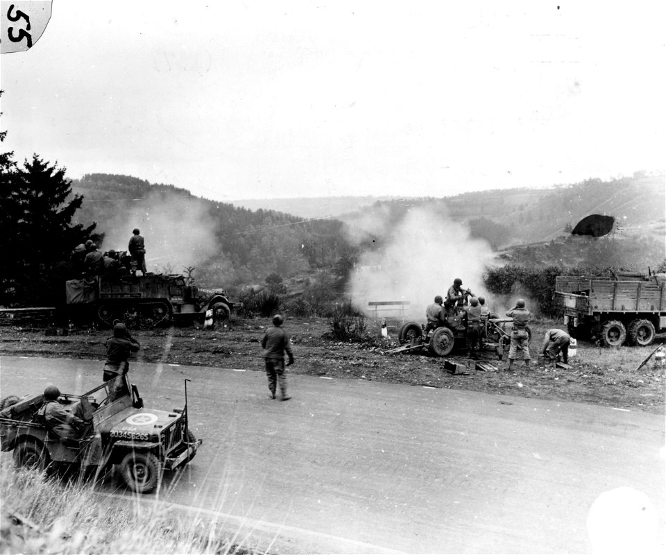 SC 196162 - Half track, left, and Bofors anti-aircraft gun, right, now in use against enemy ground targets inside Germany. 2 November, 1944.