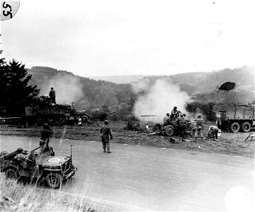 SC 196162 - Half track, left, and Bofors anti-aircraft gun, right, now in use against enemy ground targets inside Germany. 2 November, 1944. photo