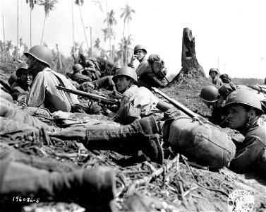 SC 196086-S - Troops pinned down on a beach on Leyte Island, P.I., by Jap mortar and machine gun fire.