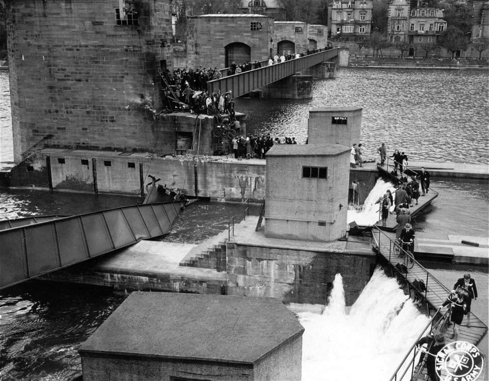 SC 335295 - Showing none of the usual sentiment for the Fatherland, the crumbling German Wehrmacht with characteristic thoroughness destroyed the bridges over the Neckar River connecting Neunheim and Old Heidelberg. photo