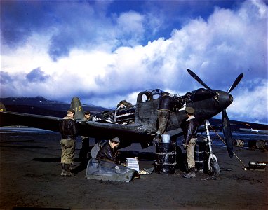 C-878 - Maintenance crew repair a P-39 on an airfield in the Aleutian Islands, Alaska.
