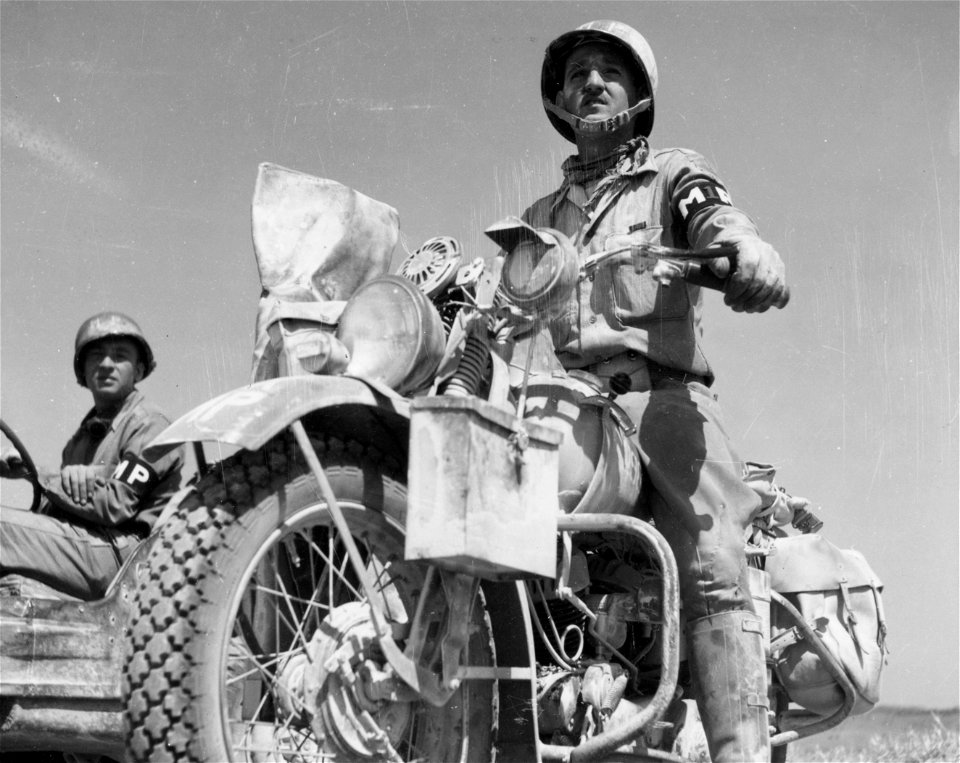 SC 184687 - Motorcycle M.P. Pfc. Norman Ridge, Langhorne, Pa., taken in Barrafranca, Sicily. 19 July, 1943.