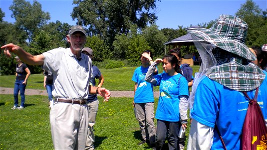 Phil Jenne with the Wildlife Rehabilitation Center explains  to members of the "Green Team" why this park provides good habitat for the young birds.