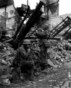 SC 337210 - Two linemen of the 101st Infantry Regt., 26th Division, check vital communication wires. photo