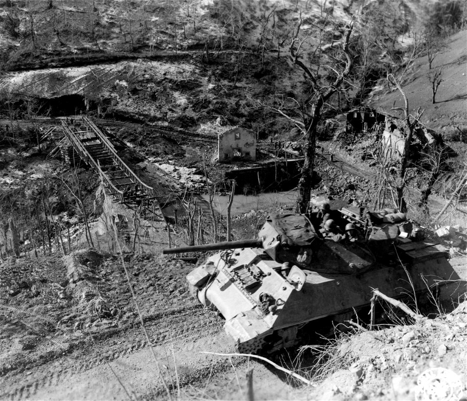 SC 329838 - Tank destroyers of the 701st Tank Destroyer Bn., mounting 3 inch guns, advance along mountain road in support of the 10th Mtn. Div., which is pushing north from Porretta toward the Po Valley.