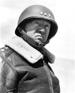 SC 171646 - Lt. Gen. George Patton, commander of II Army Corps, at the front viewing troops south of El Guettar, Tunisia. 30 March, 1943.