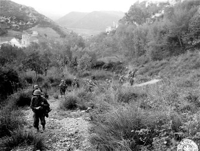 SC 270611 - 1st Bn., 30th Inf., 3rd Division ascending rocky mountainous path towards Vairano, Italy. 2 November, 1943. photo