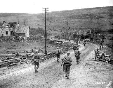 SC 270665 - Infantrymen of the 12th Infantry Regiment, 4th Division, U.S. Third Army, near Prum, Germany, move up to attack the town. 28 February, 1945. photo