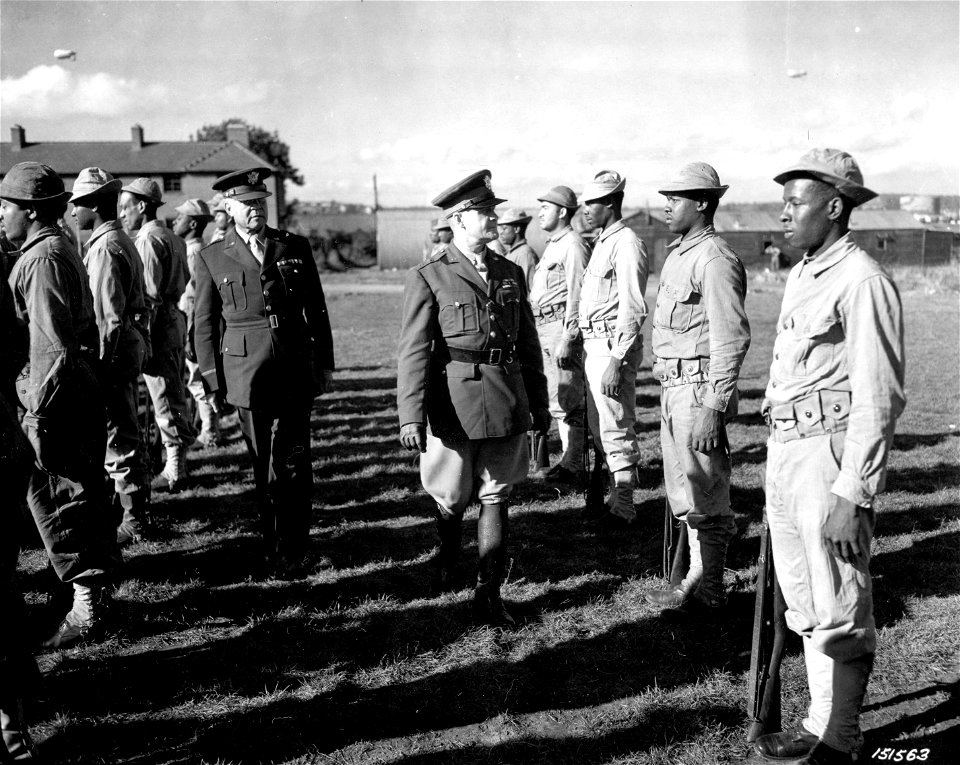 SC 151563 - Major General John C.H. Lee and Brig. General Benjamin O. Davis inspect Services of Supply troops somewhere in England. 2 October, 1942.