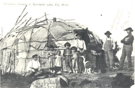 Native American family and visitors in front of wigwam at Burntside Lake, 1916 photo