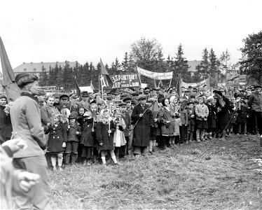SC 405034 - Russian children at the displaced persons camp at Baumholder, Germany, celebrate May Day. For some, it is the first they have ever seen. 1 May, 1945.