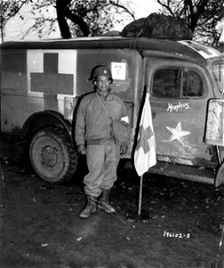 SC 196102-S - Capt. Garland N. Adamson, Chicago, Ill. is unit surgeon of an outfit near Nancy, France. 5 November, 1944. photo