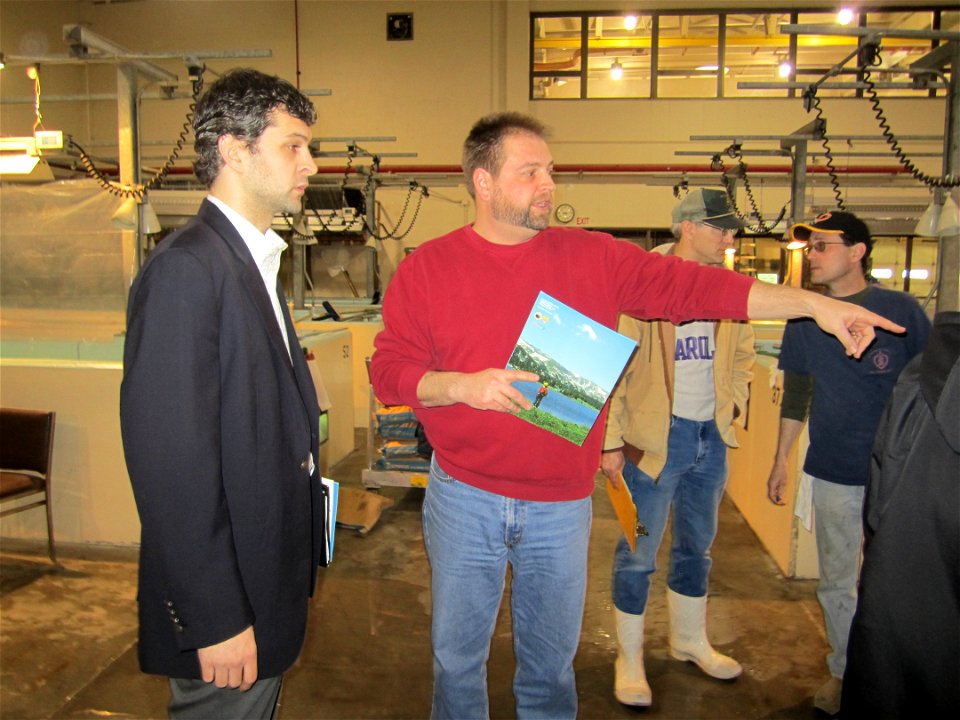 Illinois DNR biologist Steve Robillard describes hand clipping operations to a congressional staff member.