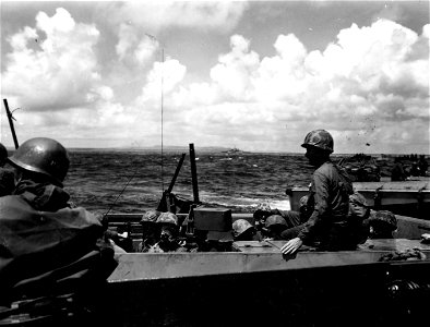 Lt. Col. J. L. Chambers, Tobeck Ave., Washington, D.C., of the 25th Marines, in the second wave to hit Saipan, as he is shown aboard an LSVP.