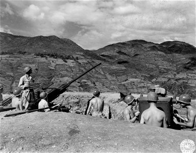 SC 196169 - Gun crew of a 40mm Bofors AA gun on the alert guarding the Burma Road and Hwoi Tung Bridge.