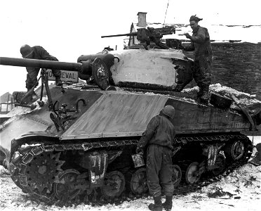 SC 374707 - Men of A Company, 774th Tank Battalion, 83rd Infantry Division, paint their M-4 tanks white to camouflage them. photo