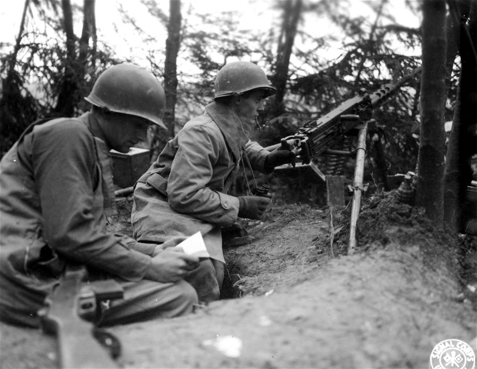 SC 396906 - Seventh Army cavalrymen (L-R) Pvt. Ralph W. Adams, 11 Boutelle St., Leominster, Mass., and Pvt. Frank G. Lapka, 115 Honesdale Rd., Carbondale, Pa., wait by their machine gun for further enemy activities...