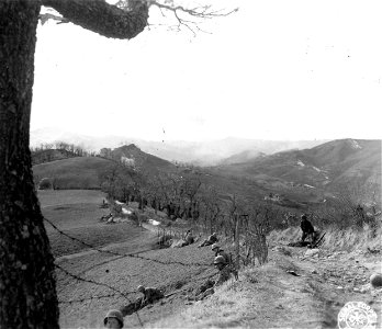 SC 270860 - Infantrymen of "K" Co., 87th Inf. Regt., 10th Mtn. Div., digging in on a ridge commanding the Porretta Moderna Highway north of Sassomolare... photo