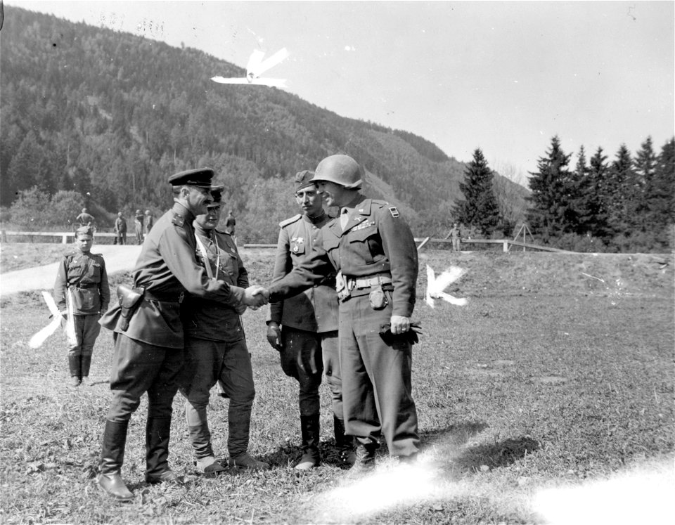 SC 337125 - Lt. Col. Tisachnee, representing the Russian [censored] (21st) infantry Division with his staff [illegible] greets with Col. George W. Smythe, Norristown, Pa., Assistant Divisional Commander, 80th Infantry Division...