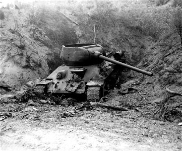 SC 348914 - Result of napalm bomb on enemy tank guarding the main road to Waegwan, Korea. 20 September, 1950. photo