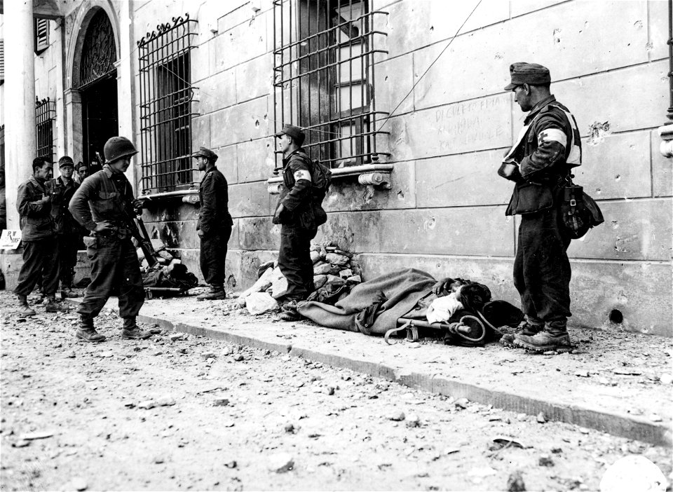 SC 337142 - Sgt. Tom Takahashi, "K" Co., 442nd Inf. Regt., took two days escorting these German prisoners and their litter cases from high in the mountains east of Massa down to a PW cage. photo