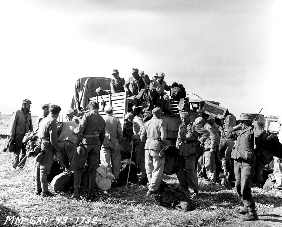 SC 171624 - Unloading German prisoners arriving at one of the P.O.W. camps in Mateur, Tunisia, North Africa. 10 May, 1943.