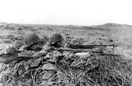 SC 364290 - Pfc. Erwin H. Hinderer, Manchester, Mich., left, and Pfc. Jack Minar, 831 W. Garrison St., Chicago, Ill., watch the flank of their Battalion of the 102nd Infantry Division, 9th U.S. Army. photo