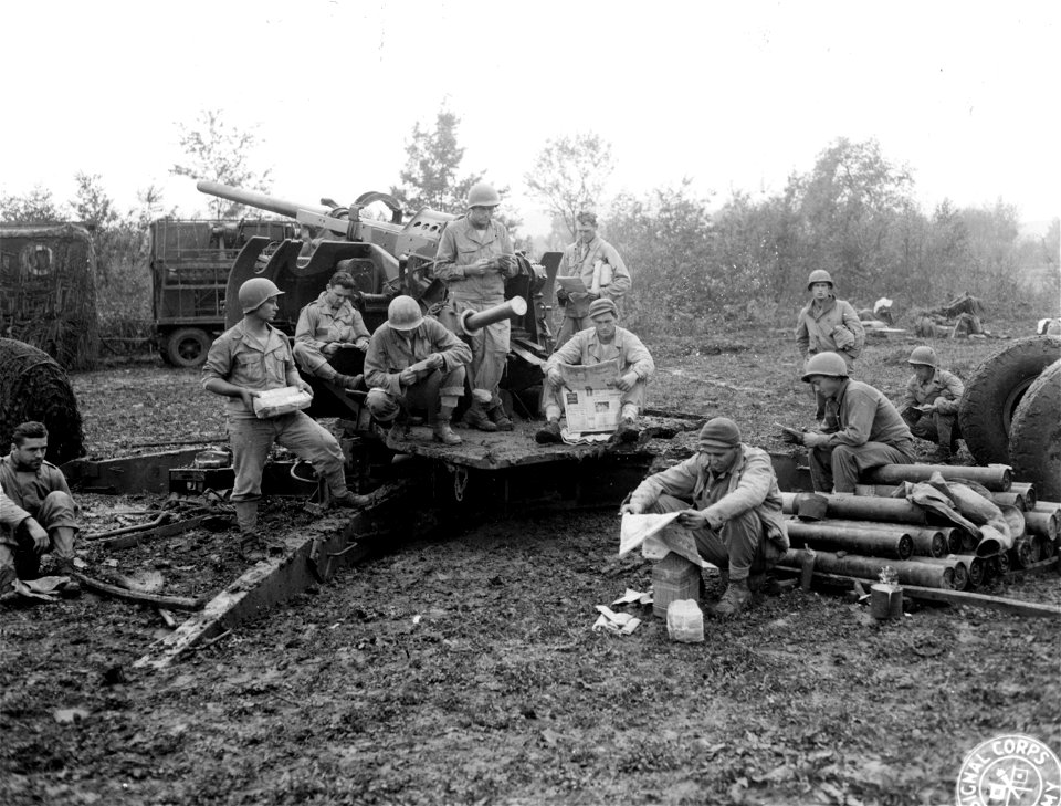 SC 396900 - Members of the 68th Coast Artillery Anti-Aircraft relaxing around their gun awaiting an alert. Mignano sector, Italy. 22 November, 1943.