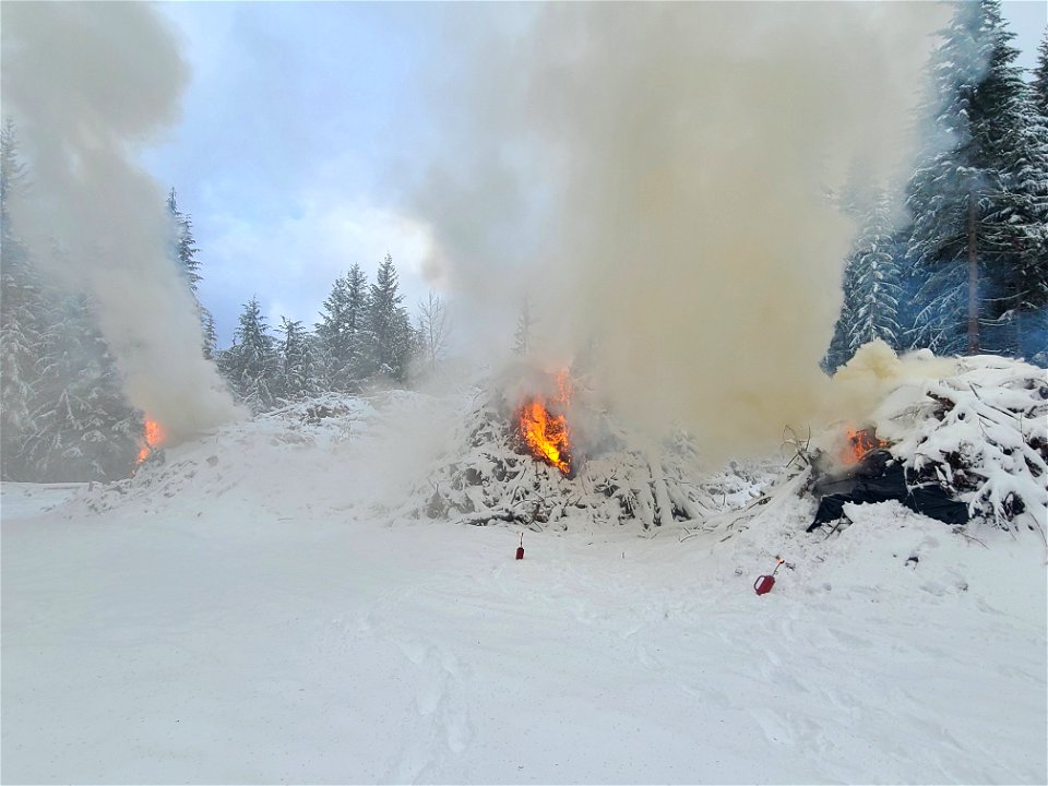 Pile burning on the Gifford Pinchot National Forest on Nove 30, 2022. Snowy conditions reduce the risk of fires escaping safety perimeters while still allowing burn objectives to be accomplished.