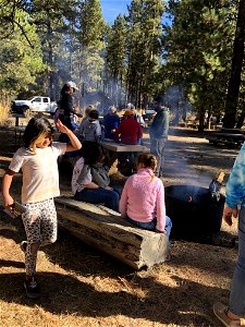 A group of kids learn about forest science at an Every Kid Outdoors Field Day