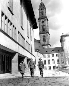 SC 335287 - Yanks at Heidelberg: Three Yanks stroll through the grounds of one of the newer Heidelberg University buildings,