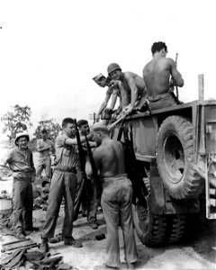 Salvage unit of 2nd Marine Division. More than 250 weapons and 30,000 pieces of clothing and equipment were salvaged by this unit. Saipan. July, 1944.
