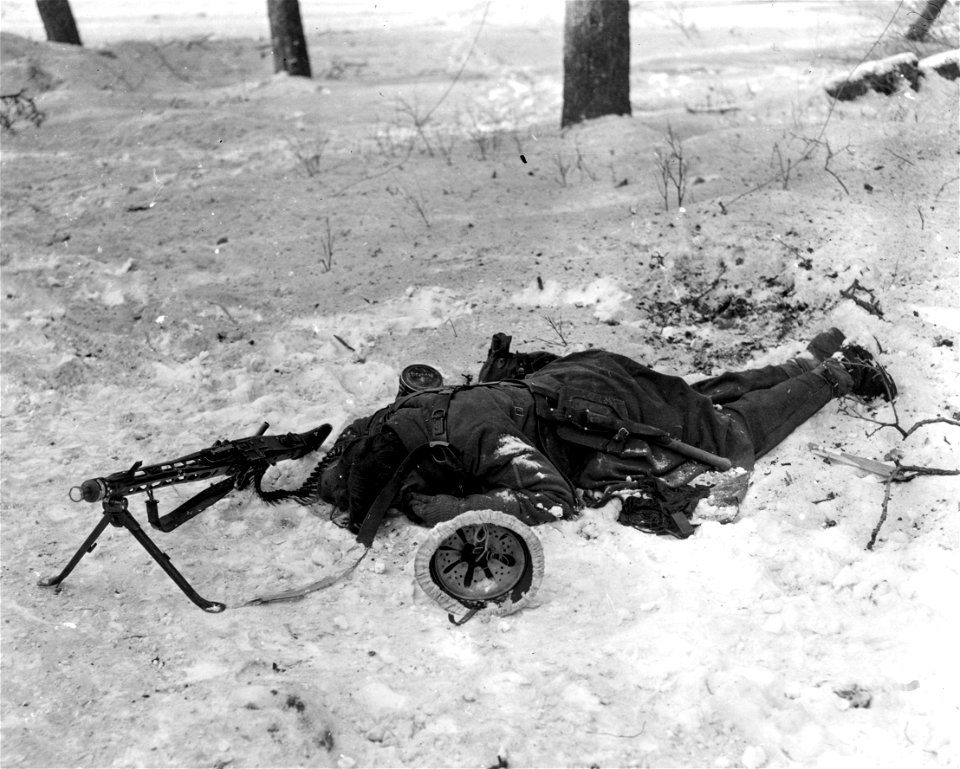 SC 198806-S - German machine gunner stopped by Yank bullets as he charged to within 10 yards of 94th Division outpost guard near Tittingen, Germany. 20 January, 1945.