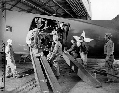 SC 364551 - Tricky procedure of unloading a 40mm Bofors from C-47 transport plane at Garbutt Field, Townsville, Queensland, Australia, at its most critical stage. photo