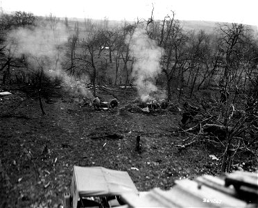 SC 364267 - Two mortars, one a captured Nazi piece, are fired together toward German positions near Guiderkirch, France, by men of the 3rd Battalion, 324th Infantry Regiment, 44th Division, Seventh U.S. Army.