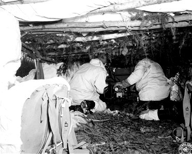 SC 364473 - Inside of the camouflaged lean-to which sets to conceal gunners, manning 37mm AT gun, from both aerial and ground observation. photo