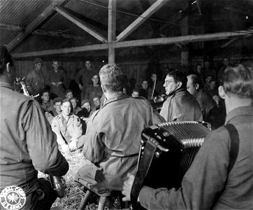 SC 195681 - Music is one of the chief forms of entertainment given to soldiers back from the front who have 48 hours of relaxation in this rest camp set up for members of the 102nd Cav. Grp. photo