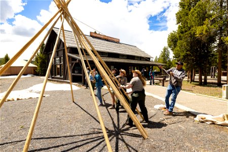 Yellowstone Tribal Heritage Center opening day 2023:tying poles together