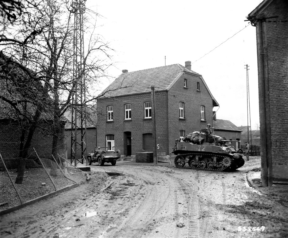 SC 335567 - After Rheindahlen, Germany, has fallen to the troops of the U.S. Ninth Army, American armor rolls into the town. 27 February, 1945.