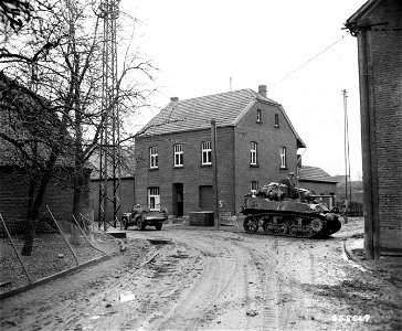 SC 335567 - After Rheindahlen, Germany, has fallen to the troops of the U.S. Ninth Army, American armor rolls into the town. 27 February, 1945. photo