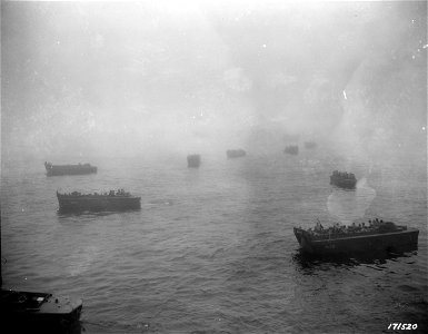 SC 171520 - First wave of assault groping its way shore through a curtain of enveloping fog. Attu, Aleutians. 1943.
