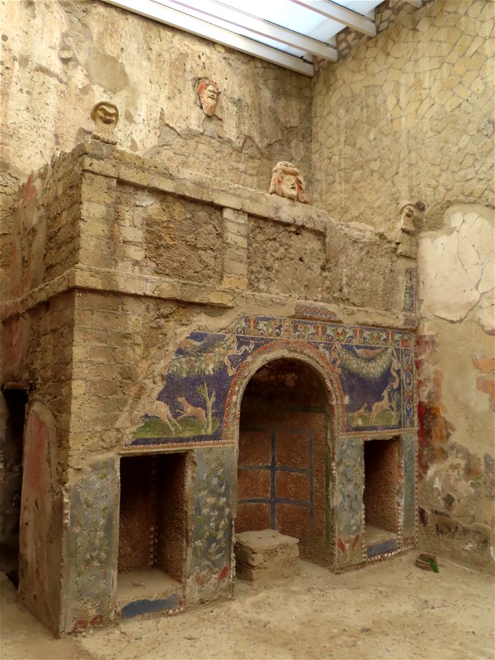 Nymphaeium masks and tank feeding fountain House of Neptune and Amphrite  Herculaneum Italy